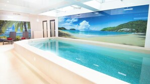 A swimming pool with a mural of a beach scene. - Luxury villa with indoor pool, 5 minutes from the sea via Groom* (Larmor-Plage)