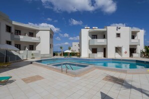 Seasonal outdoor pool, open 9:00 AM to 7:00 PM, pool umbrellas - John Mary Apartments by Estia (Hersonissos)