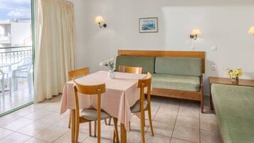 Superior Apartment, Balcony | Living area | TV