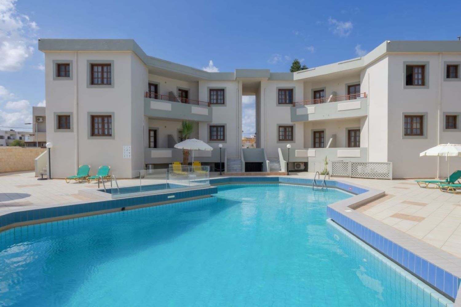 Seasonal outdoor pool, open 9:00 AM to 7:00 PM, pool umbrellas