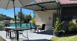 Outdoor dining - First Floor Unit with big patio. Countryside steps away from beautiful beaches. (Cabo Rojo)