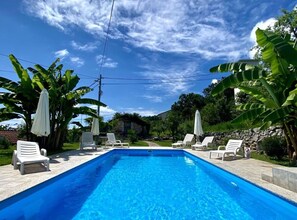 Seasonal outdoor pool, pool umbrellas