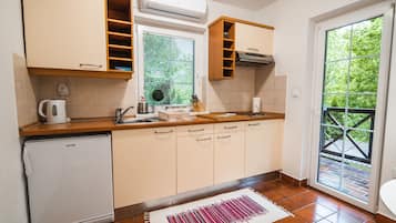 Apartment (Standard One Bedroom Apartment with T) | Private kitchen | Fridge