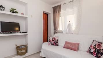 Apartment (One Bedroom Apartment) | Living room | 32-inch flat-screen TV with cable channels, stereo