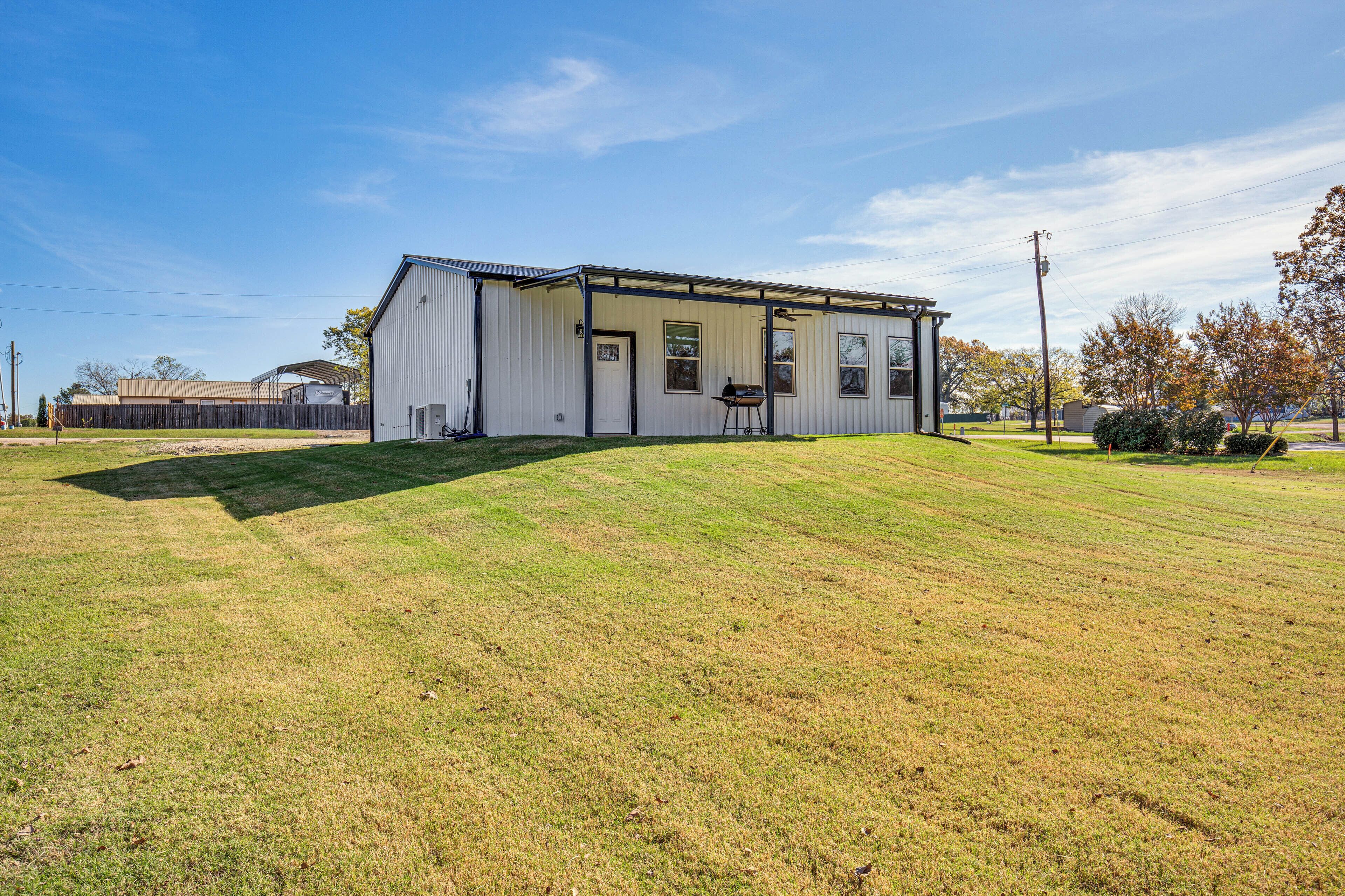 A single-story building with a flat roof and a covered porch area.