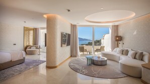 A spacious hotel room with a balcony, a bed, a sofa, and a coffee table. - ZEM Wellness Clinic Altea - 5 Stars Grand Luxury (Altea)