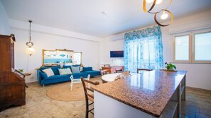 Apartment, Balcony, Sea View | Living area | 32-inch flat-screen TV with cable channels