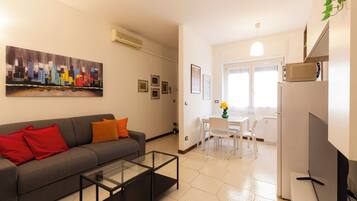 Comfort Apartment | Living area | 50-inch Smart TV with digital channels