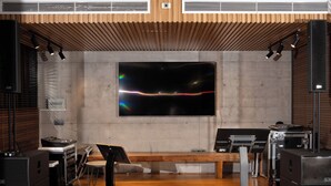 A modern music studio with wooden panel ceiling, a large flat-screen TV, and various audio equipment. - Palm Villa (Mang Yang)