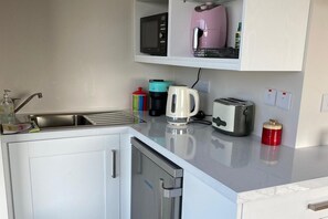 Fridge, microwave, electric kettle, toaster