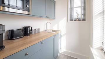 Coffee/tea maker, fridge, microwave, electric kettle