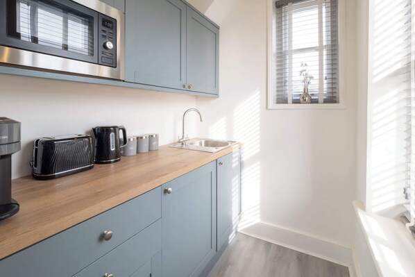 Fridge, microwave, coffee/tea maker, electric kettle