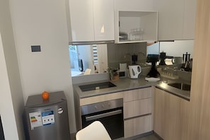 Apartment | Private kitchen | Fridge, oven, cookware/dishes/utensils, dining tables