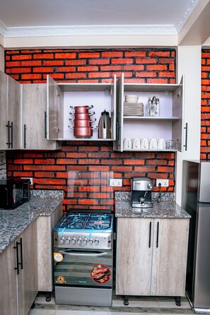 Comfort Apartment, 2 Bedrooms, Smoking, City View | Private kitchen - Kadoo Travels (Kigali)
