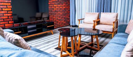 Comfort Apartment, 2 Bedrooms, Smoking, City View | Living area | 65-inch Smart TV with digital channels