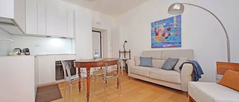 Apartment | Living area | 36-inch flat-screen TV with cable channels