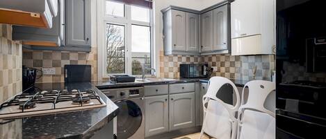 Fridge, cookware/dishes/utensils, dining tables