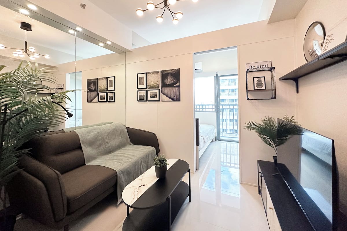 Deluxe Condo, Balcony, Pool View | Living area | 40-inch flat-screen TV with digital channels