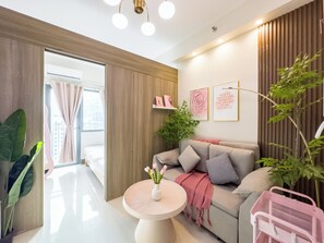 Honeymoon Condo, 1 Queen Bed with Sofa bed, Kitchen | Living area | 40-inch flat-screen TV with digital channels - GemstoneBR in SMDC Fame Residences (Mandaluyong)