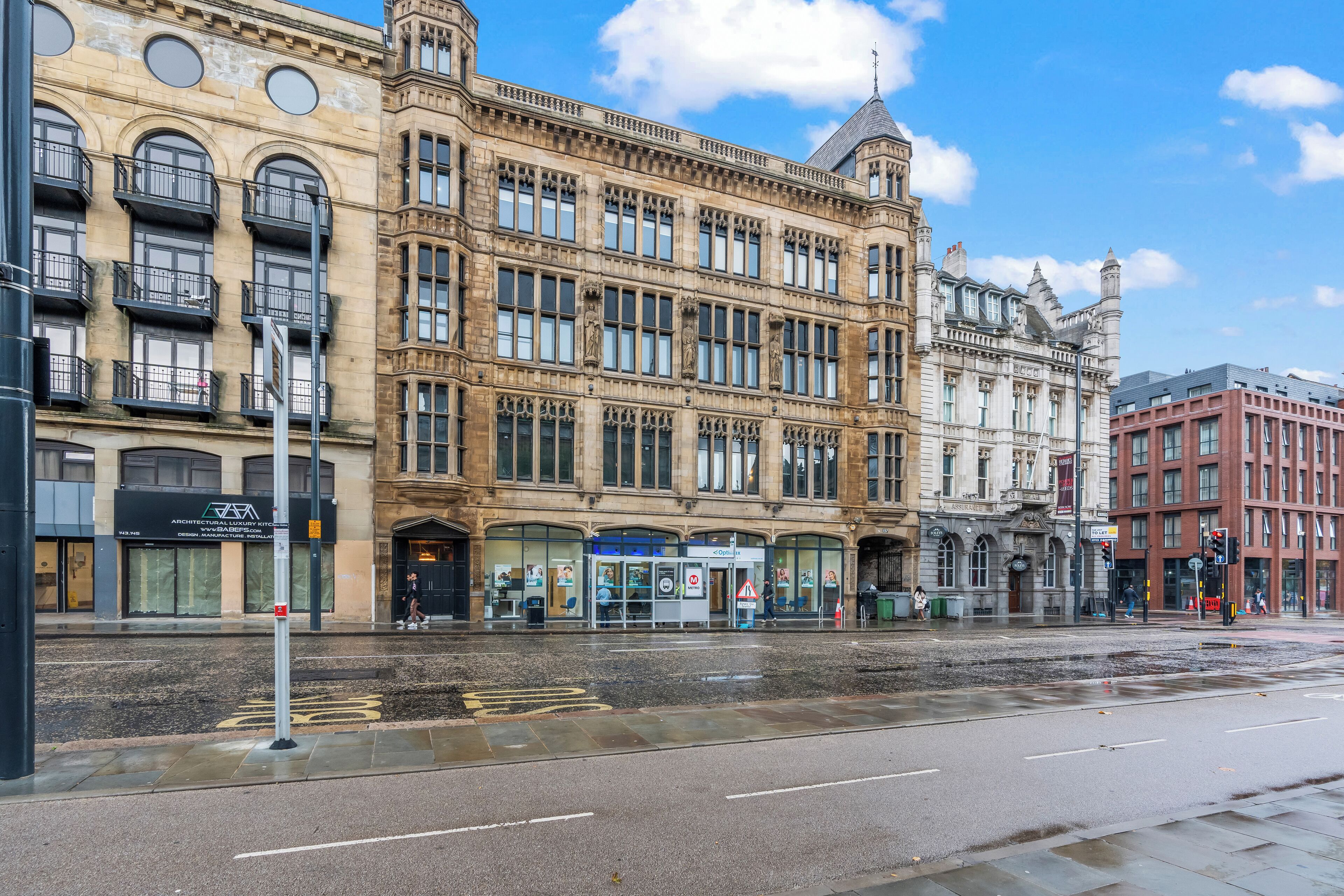 A historic building with large windows and a classic architectural style.