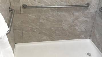 Bathtub, hair dryer, towels, soap