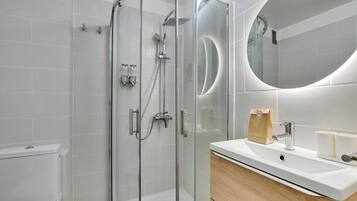 Shower, hair dryer, towels, shampoo