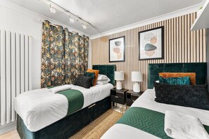 4 slaapkamers, een strijkplank/strijkijzer, beddengoed
