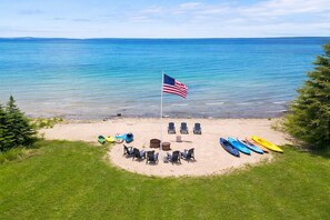 On the beach, sun-loungers - Lake Huron Beachfront, Hot Tub, Kayaks, Firepit and Amazing Views. (Cheboygan)