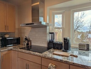 Fridge, microwave, oven, stovetop - Unique 4-bedroom house on the edge of Santa Fe filled with amazing things. (Santa Fe)