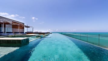 Outdoor pool, pool umbrellas, sun loungers