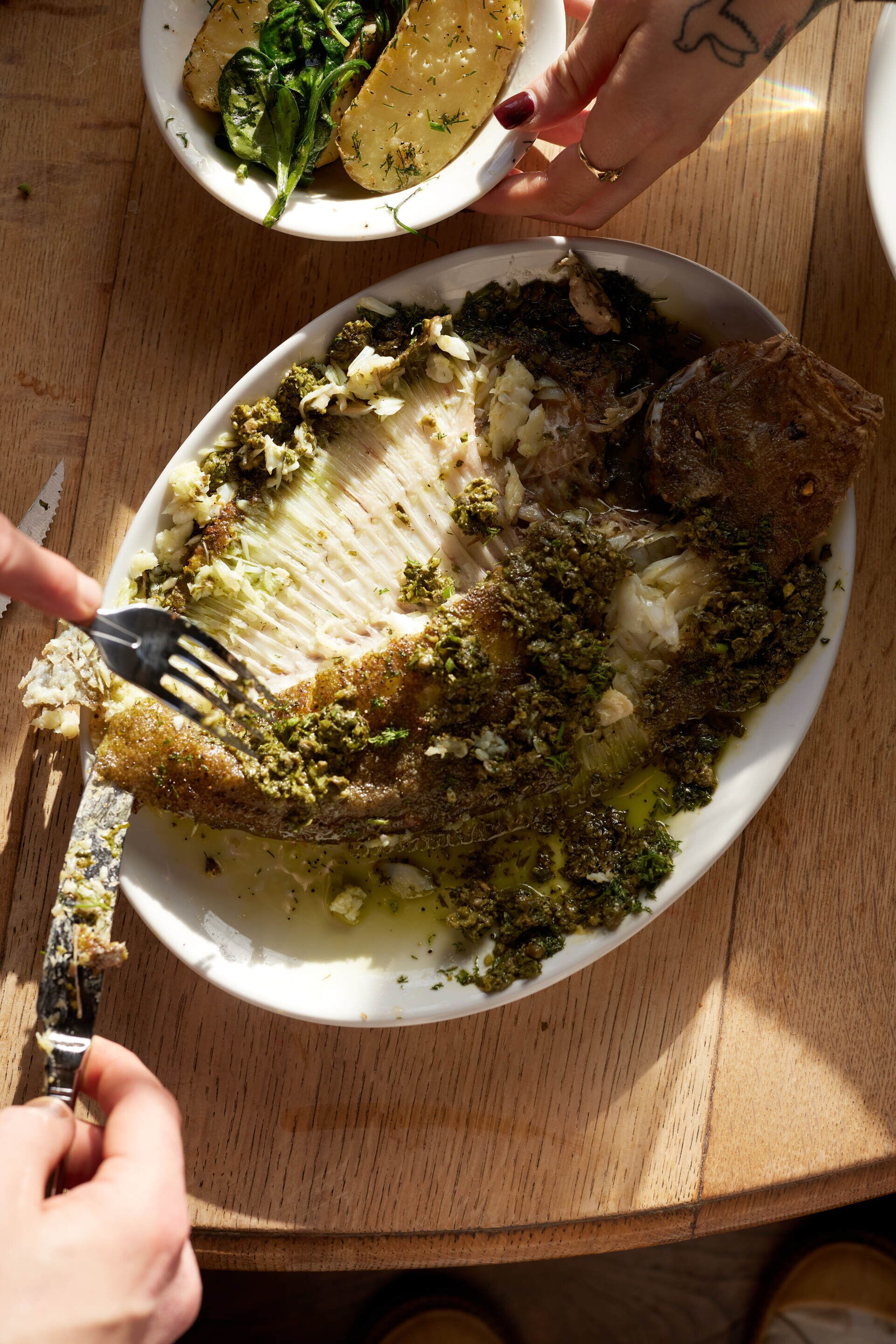 A plate of food with a fork and a knife.