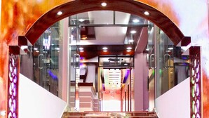 A staircase with a metal railing and a glass door at the top. - Hotel Aranna Residential Bandarban (Bandarban)