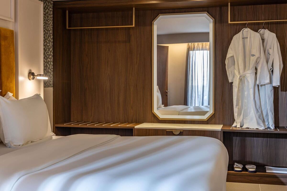Premium bedding, desk, laptop workspace, soundproofing