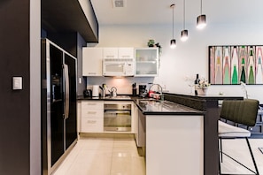 Fridge, microwave, stovetop, coffee/tea maker