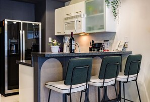 Fridge, microwave, stovetop, coffee/tea maker