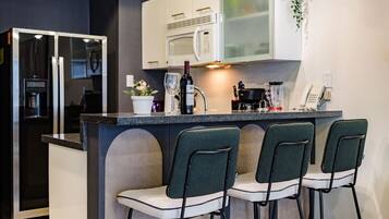 Fridge, microwave, stovetop, coffee/tea maker