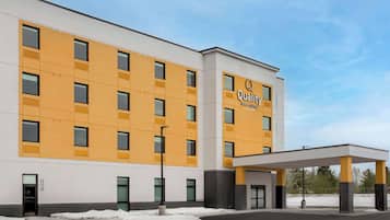 Stylish hotel with a symmetrical design and grid-patterned windows.