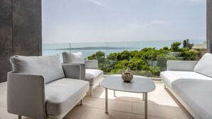 A modern outdoor seating area with a glass balustrade overlooking a scenic landscape. - Villa Rora - Four Bedroom Villa, Sleeps 8 (Brela - Krug)