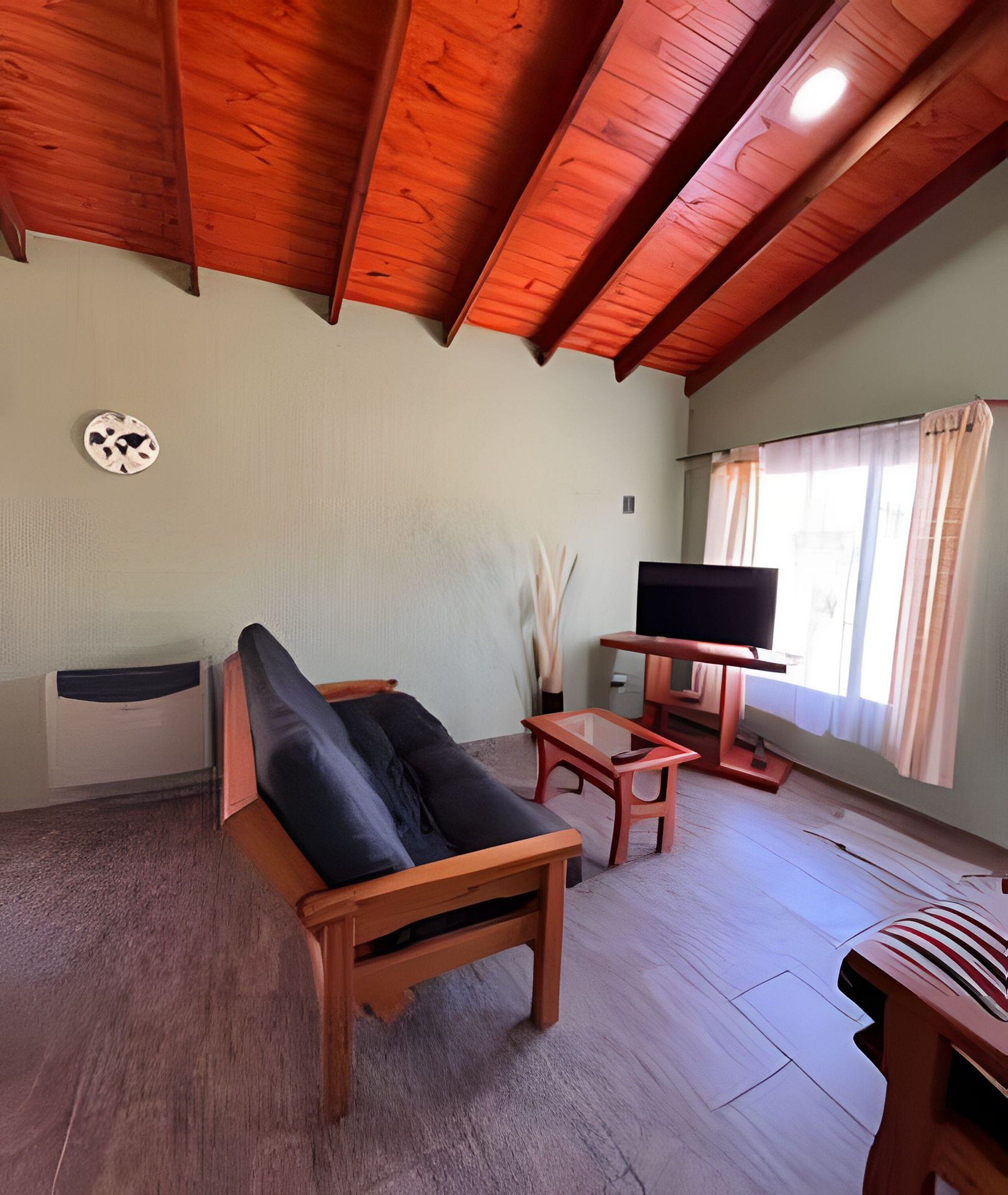 Deluxe Cabin | Living area | 42-inch Smart TV with cable channels