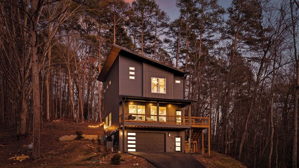 A two-story house with a balcony, large windows, and a garage. - 3 Stry Treehouse Chickamauga 20 min to Chatt Vistas (Walker County)