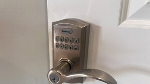 A door with a numeric keypad lock labeled "Kwikset". - Cora's Suite at the Flyin H Ranch (Tyler)