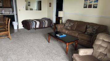 Standard Condo | Living area | 43-inch Smart TV with satellite channels, DVD player, pay films