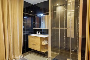 Shower, hair dryer, towels, soap