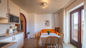 A modern kitchen with a built-in microwave, a coffee maker, and a sink. - 723A Apartment Burgunderhof (Termeno sulla strada del vino)