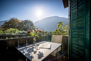A table with a view of mountains and a clear sky.