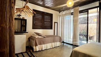 Quarto triplo superluxo, vista para o jardim | Vista do quarto