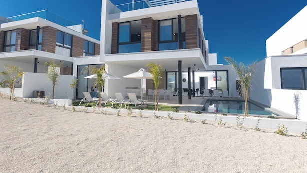 A modern two-story house with a pool, outdoor seating, and a clear blue sky. - Villa Malin, Brand New, 5BDR Protaras Villa with Heated Pool (optional) (Protaras)