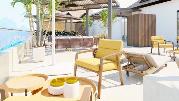 A rooftop lounge with outdoor seating, including yellow chairs and a table with yellow cups. - Depa Bucearías playa (Bucerías)