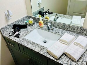 Shower, hair dryer, towels, soap