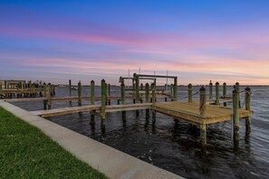Stroll along the pier, taking in the serene views of the marina.